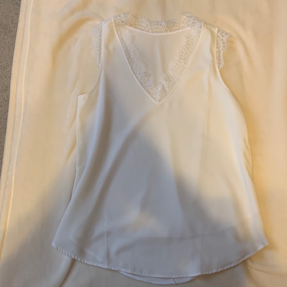 White fancy tank top with eyelash lace around neck. Size Small